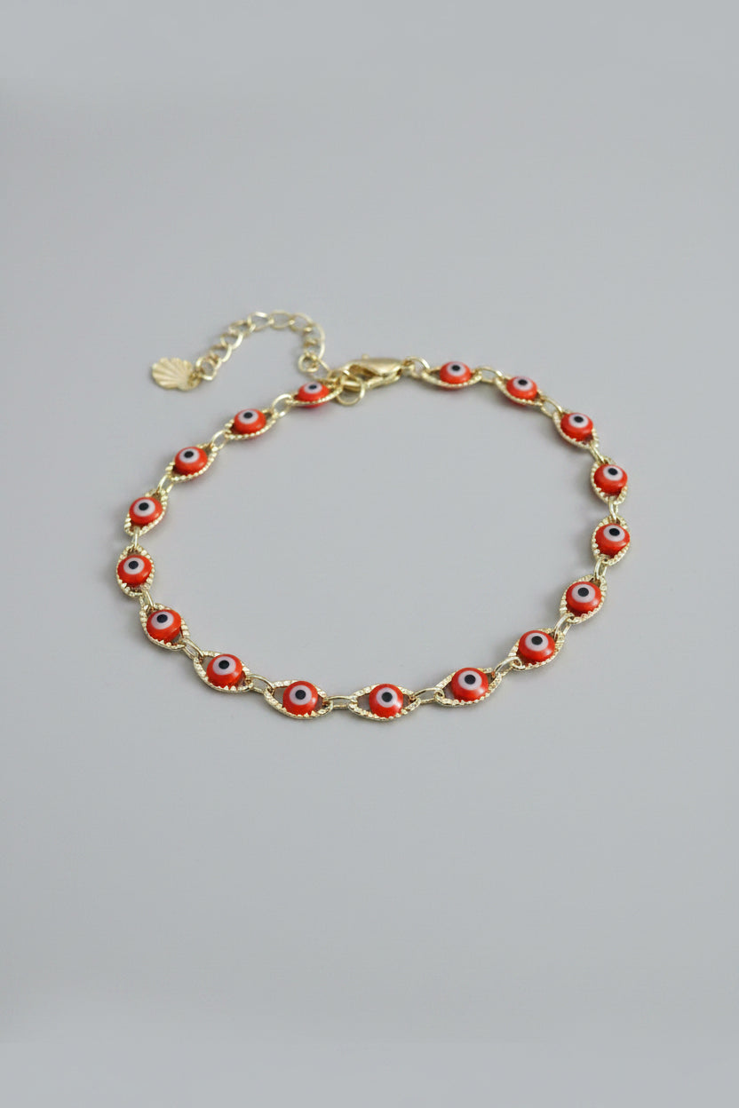Pulsera Laminada Dorada con Mini Ojos Turcos Rojos – Ajustable
