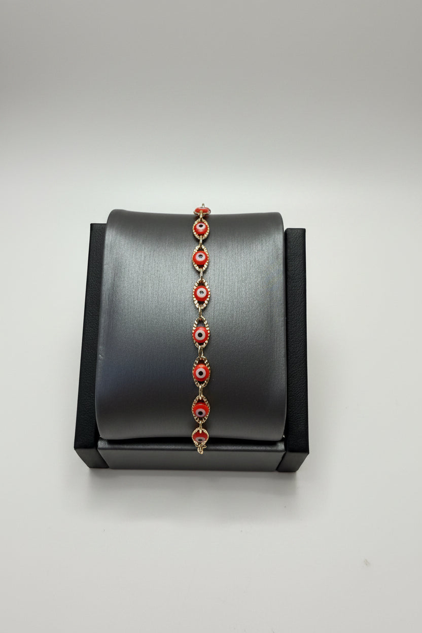 Pulsera Laminada Dorada con Mini Ojos Turcos Rojos – Ajustable