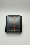 Pulsera Laminada Dorada con Mini Ojos Turcos Rojos – Ajustable